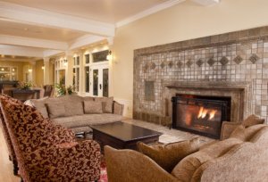 Hotel lobby fireplace at a lakeside resort illustrating hotel deal comparisons